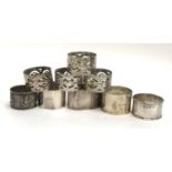 A lot of four napkin rings, a pair by William Hutton & Sons, 3.6ozt; together with a set of four