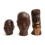 Three carved wooden busts of men, the smallest 15cmH and the largest 22.5cmH
