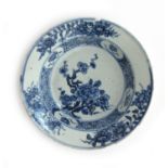 A Chinese blue and white dish, with central prunus decoration, 17cm diameter