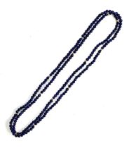 A long lapis and gold (tests as 14ct or higher) bead necklace, the lapis beads approx. 3mm in