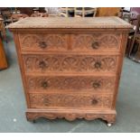 A carved oak chest, two short over three long drawers, 103x50x112cmH