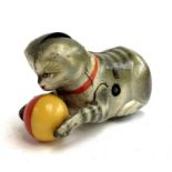 A Kohler tin plate clockwork cat with yellow and red ball between its front legs, no key, approx.