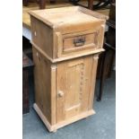 A pine bedside cabinet, top apparently missing, having a single drawer over cupboard, 42x33x87cmH