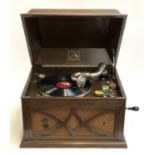 An HMV wind up gramophone in working order, together with a small quantity of 78s to include Fats