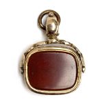 A yellow metal fob seal set with carnelian, 11.3g, 2.6cmW