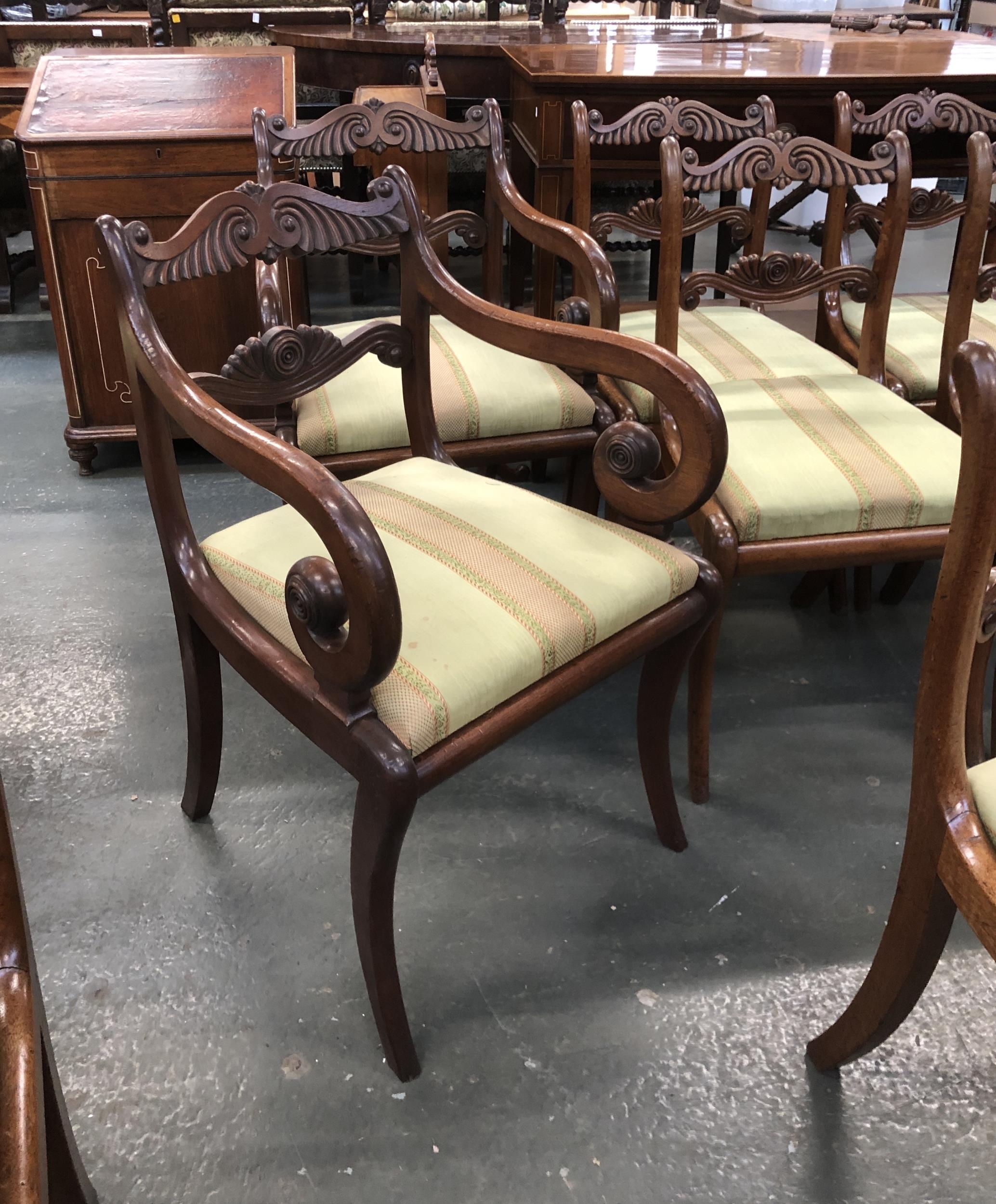 A set of twelve Regency style mahogany dining chairs, carved rails, drop in upholstered seats over - Image 2 of 2