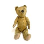A vintage teddy bear with articulated limbs and head, Steiff style, approx. 54cmL