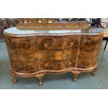 A 20th century burr walnut serpentine sideboard by Epstein, having three drawers flanked by