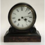 An early 20th century ebonised mantel clock on a simulated burr walnut base, enamel dial, 26cmH