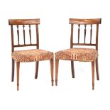 A set of eight 19th century mahogany dining chairs, curved rail with bell flower marquetry,