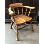 A very solid 20th century beach smoker's bow or captain's chair, the outswept arms on turned