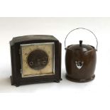 An oak cased mantel clock together with a turned wood tobacco jar