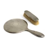 A silver backed clothes brush, by Mappin & Webb; together with a sterling silver looking glass (2)