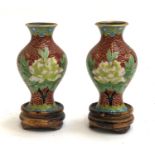 A pair of Chinese cloisonne enamel miniature vases on wooden stands, the vases 7cmH