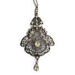 A Belle Epoque silver and paste openwork lavaliar pendant on a silver chain, 6.5cmL