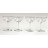 A set of four crystal glasses with engraved monogram, 11.5cmH