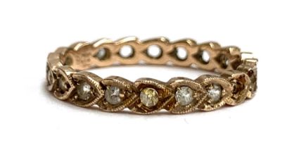 An Art Deco 9ct gold eternity ring, some paste missing, size Q, 2g