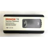 A Minox T8 pocket telescope, boxed