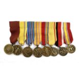 A group of eight miniature medals comprising US Navy; American Defense; American Campaign; Asiatic