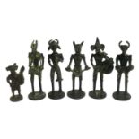 An set of five bronze anthropomorphised tribal musician figures, approx. 14cmH; together with one