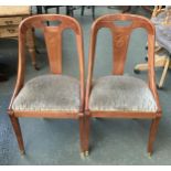 A pair of contemporary splat back side chairs, with upholstered seats, swept legs and brass caps