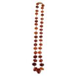 A faceted amber roundel bead necklace with metal barrel clasp, 46cm long, 23.2g