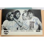 An autograph book containing a number of autographs to include Bucks Fizz, The Shadows, Cannon &