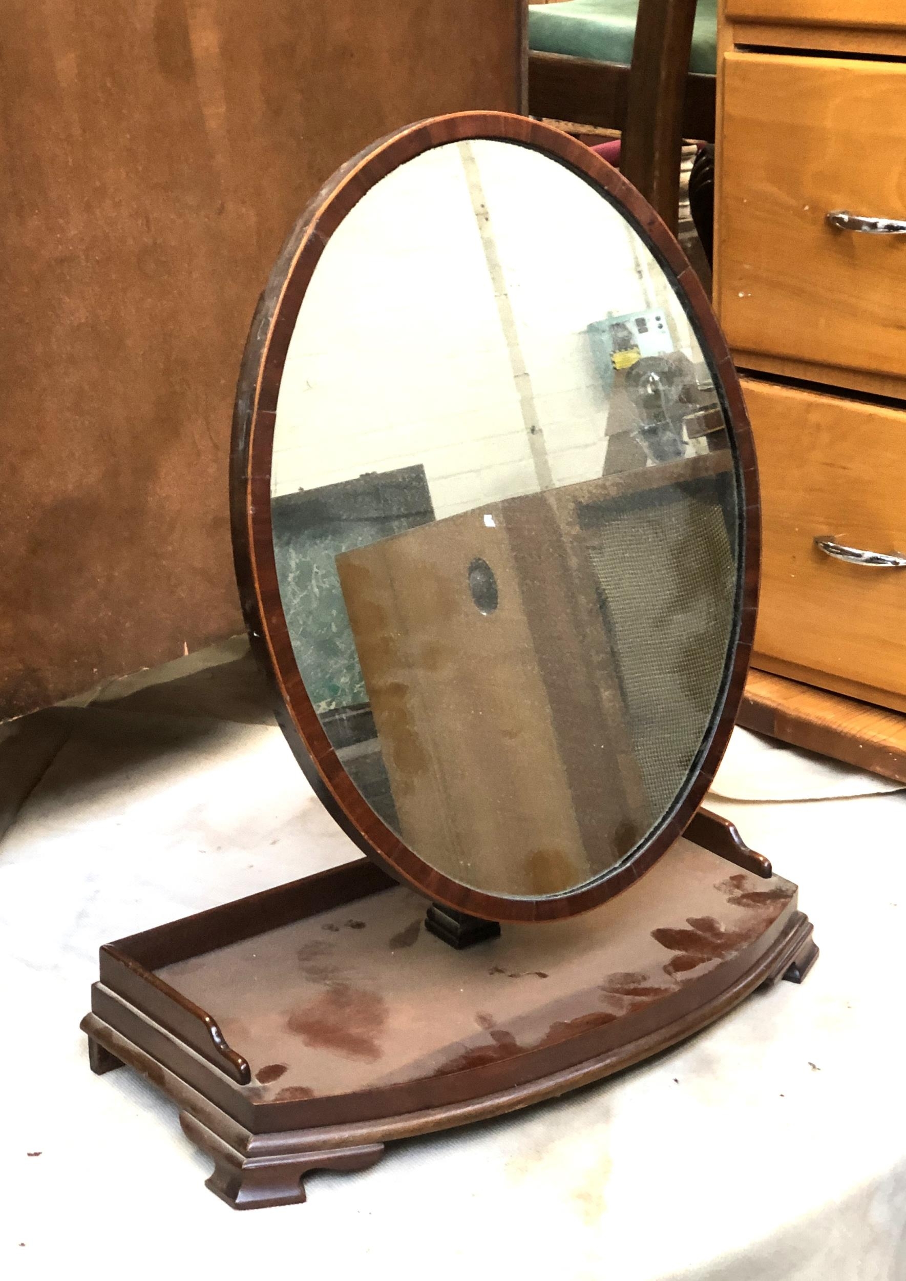 A 19th century oval shaving mirror, on bowfront galleried stand, 58cmH; together with an oval