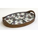 A Booths Silicon china for T. Goode & Co. ltd London seven part hors d'oeuvre tray within a bentwood