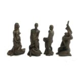 A set of four cast bronze erotic figure groups, each approx. 11cmH