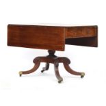 A Regency mahogany Pembroke table, with single frieze drawer and opposing blind drawer, raised on
