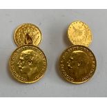 A pair of gold cufflinks made from two 1915 George V half sovereign gold coins, the backs made