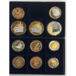 A small quantity of commemorative coins from various Royal Mint series to include the £5 banknote