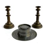A pair of bronzed metal candlesticks, 21.5cmH, together with a large capstan inkstand, 22.5cmD