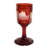 A bohemian ruby glass chalice, with four engraved panels depicting German cathedrals, 28cmH
