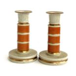 A pair of Royal Copenhagen orange crackle glaze candlesticks, heightened in gilt, no.212/3338, 18.