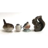 A Royal Copenhagen squirrel no. 98; Copenhagen robin (af), no. 2238; and two further bird