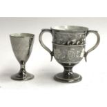 A 19th century silver lustre twin handled goblet, with grape and vine design, 12.5cmH, together with