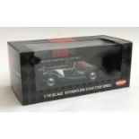 A Kyosho die cast Morgan 4/4 Series II green 1:18 scale car, boxed