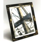A late 19th/early 20th century black japanned mirror with bevelled glass, 29x24.5cm