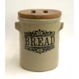 A stoneware bread bin with wooden lid, 31cmH
