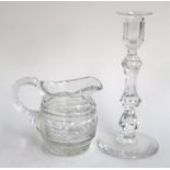 A small 19th century cut glass jug, 11cmH; together with a 19th century cut glass candlestick on