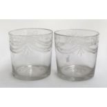 A pair of 19th century hand blown glass tumblers, engraved with bell flower swags, each approx. 8cmH