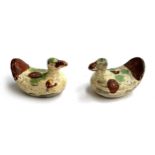 A pair of early Staffordshire style ducks in a brown, green and cream glaze, each 6cmL