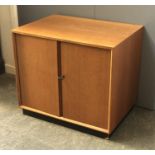 A mid century teak vinyl cabinet, on plinth base, by Dynatron Radio Ltd, model RSU 5, 61x43x53cmH