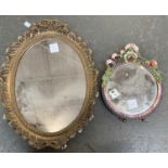 A gilt gesso style oval mirror, 46cmH, together with a floral circular mirror, 28cmH