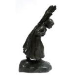 Bronze of a woman carrying firewood, signed 'J. Dasie', 50cm high