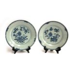 A pair of Chinese 19th century blue and white plates with floral peony design, each 24cmD