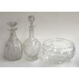A cut glass bowl, 21cmD; together with with two decanters, 25cmH and 29cmH (3)