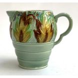 A Clarice Cliff Newport Pottery Co. 'Celtic Leaf and Berry' jug, 19.5cmH